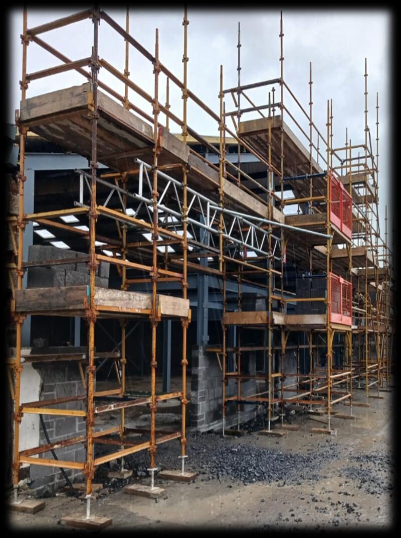 Industrial unit with beamwork over large entrance — scaffolding by Hardwood Scaffolding and Plant Ltd